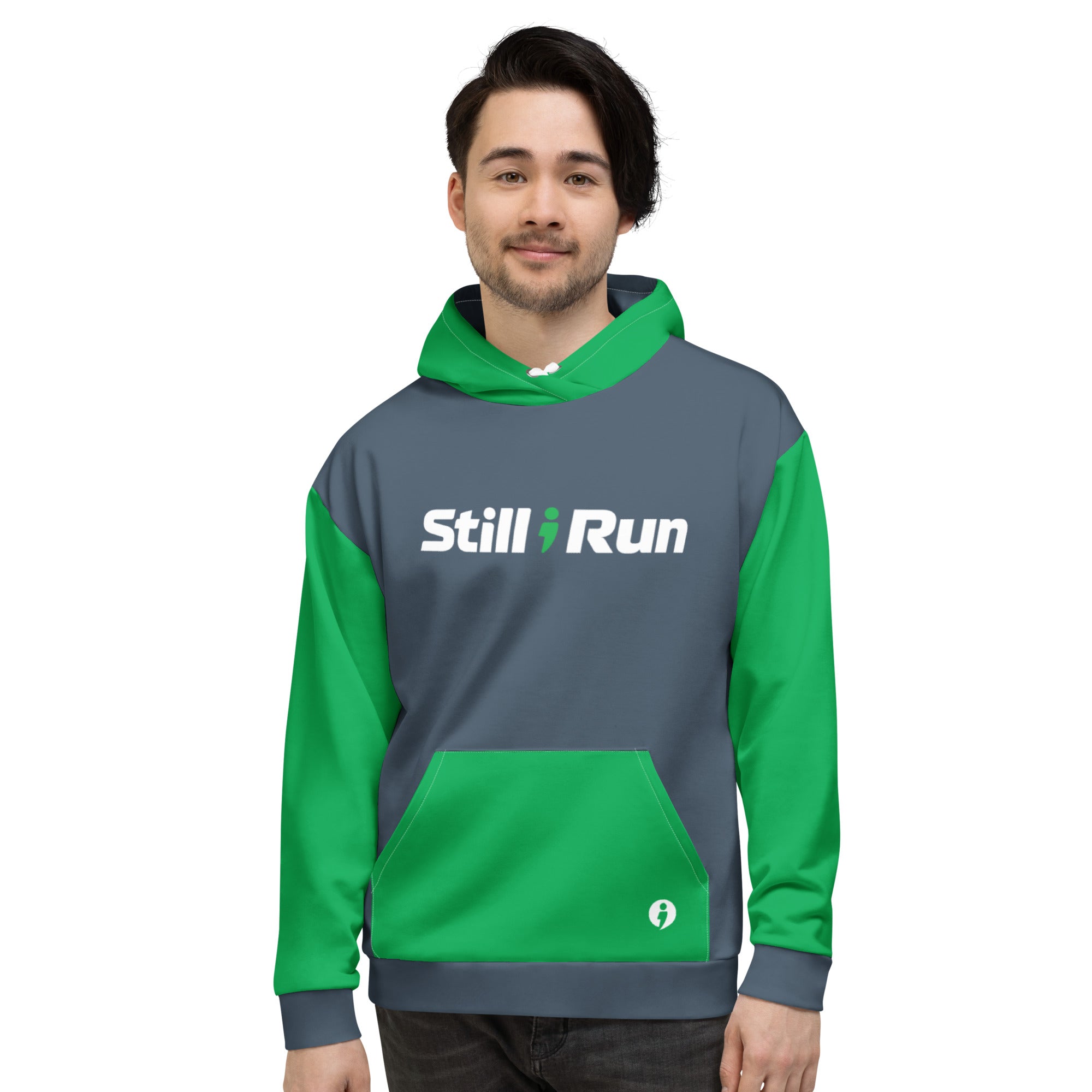 A person wearing the gray Movement Collection hoodie with the 'Still I Run' logo across the front and a white avatar featured on the bottom right side of the hoodie pocket.