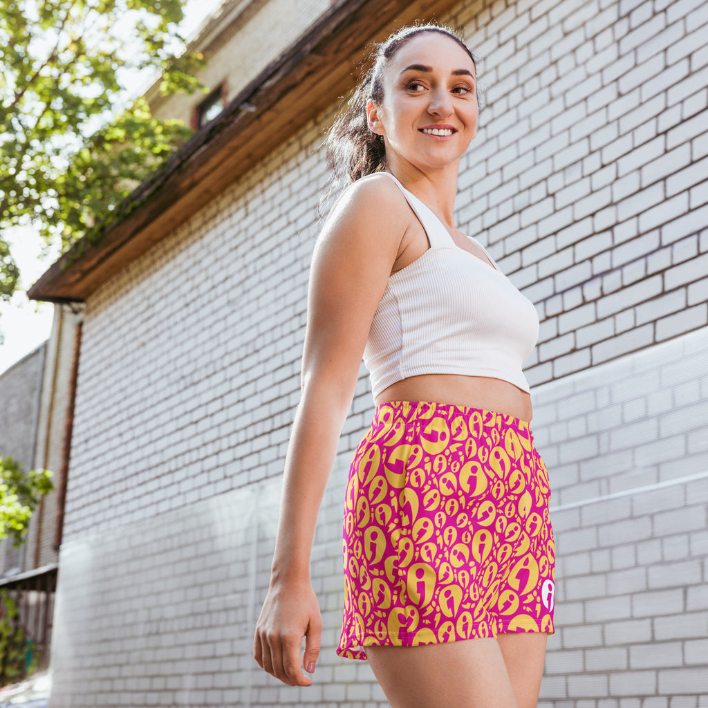Woman wearing the movement collection unisex shorts in pink with a 2.5" inseam.